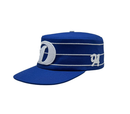 Royal blue and white pillbox cap, 90s streetwear style